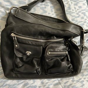 Black leather with silver toned hardware authentic Roots utility handbag